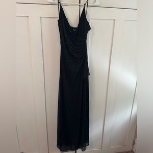 Black formal dress with rhinestones, fitted. Size Medium